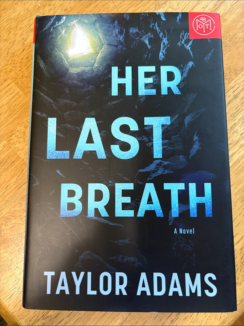 Her Last Breath by Taylor Adams - Black & Blue Hardcover Novel